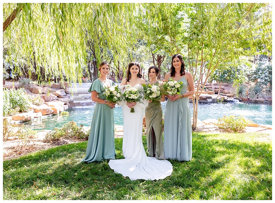 Bride with bridal party in the gardens at the Willows