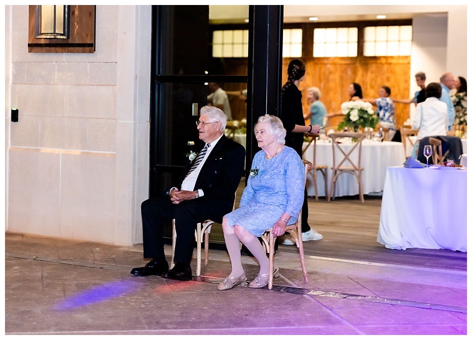 Grandparents of the groom watching a Dutch traditional dance