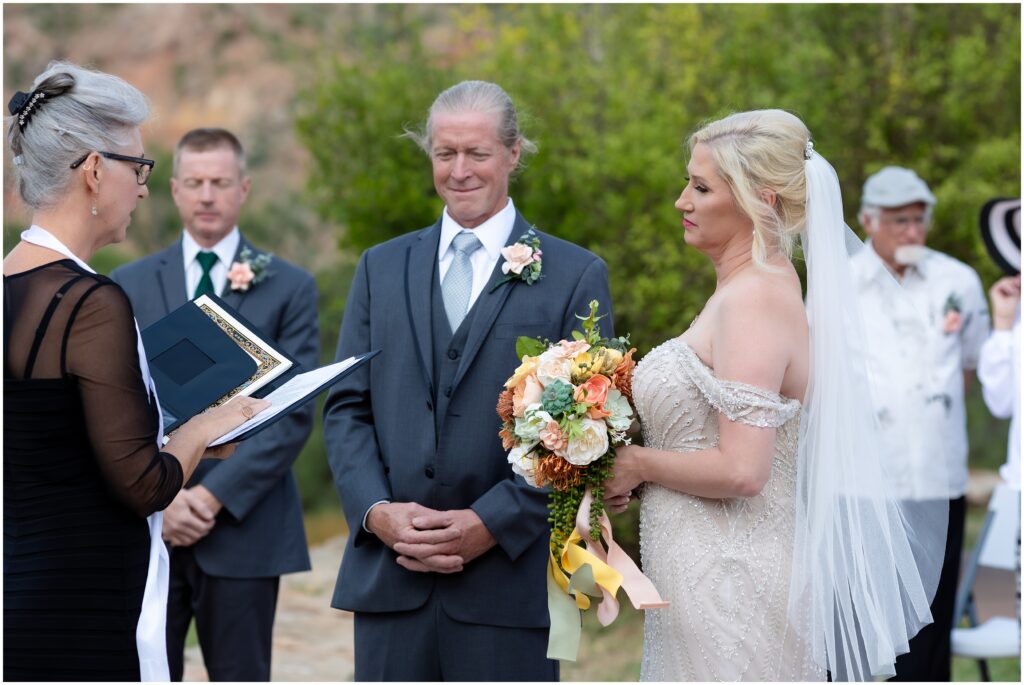 Bride and groom facing the officiant during the ceremony