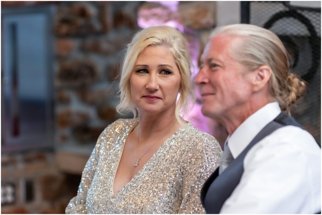 Woman looking lovingly at a man during a wedding reception